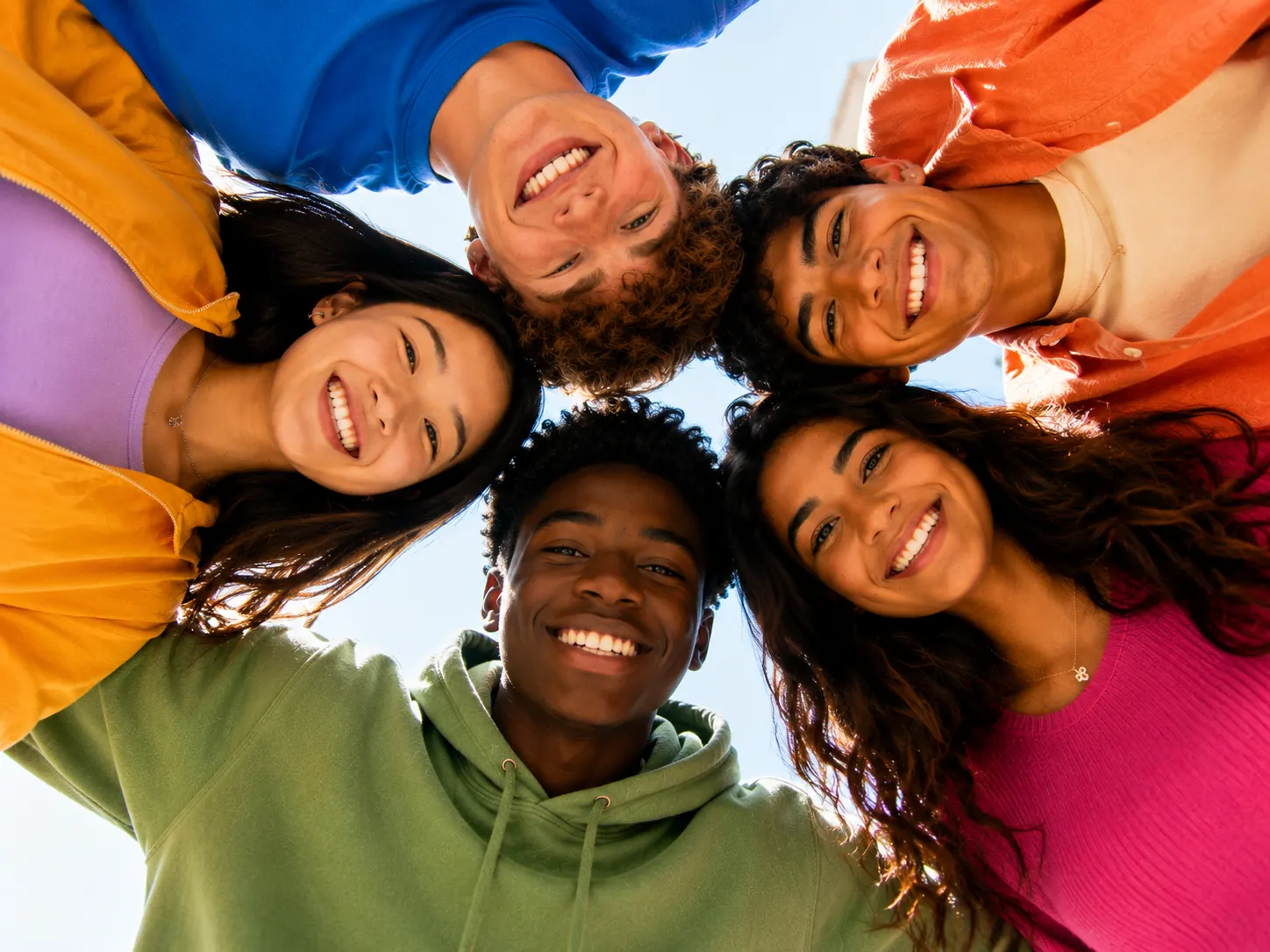A diverse group of smiling middle- and high-school students